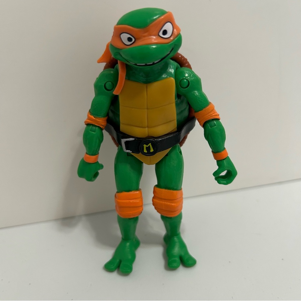 Green and Orange Action Figure